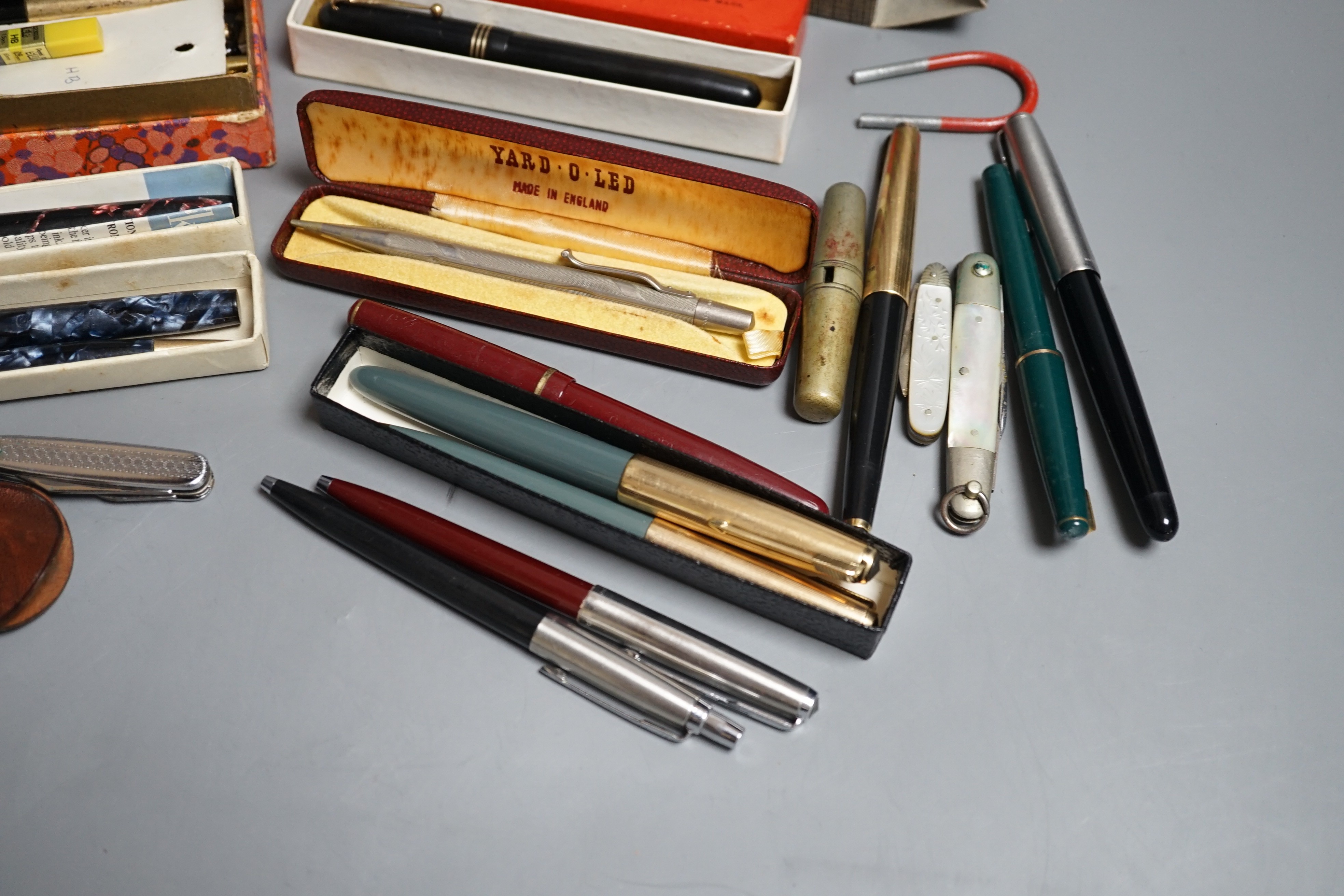 A group of fountain pens and pencils including a Waterman's ideal gold mounted pen